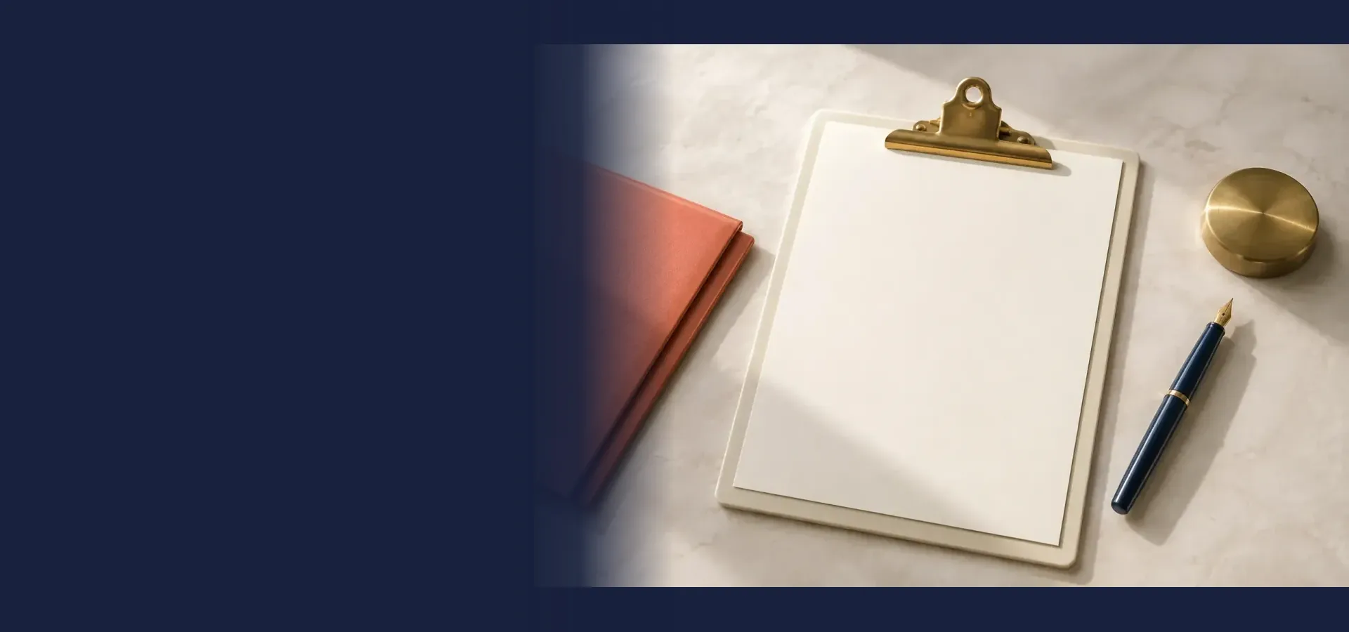 A blank clipboard, fountain pen and closed folder on a pale desk